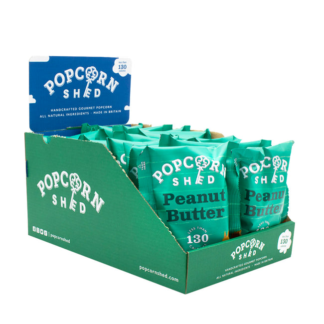 Display of Popcorn Shed peanut butter popcorn packets in a green box on a white background