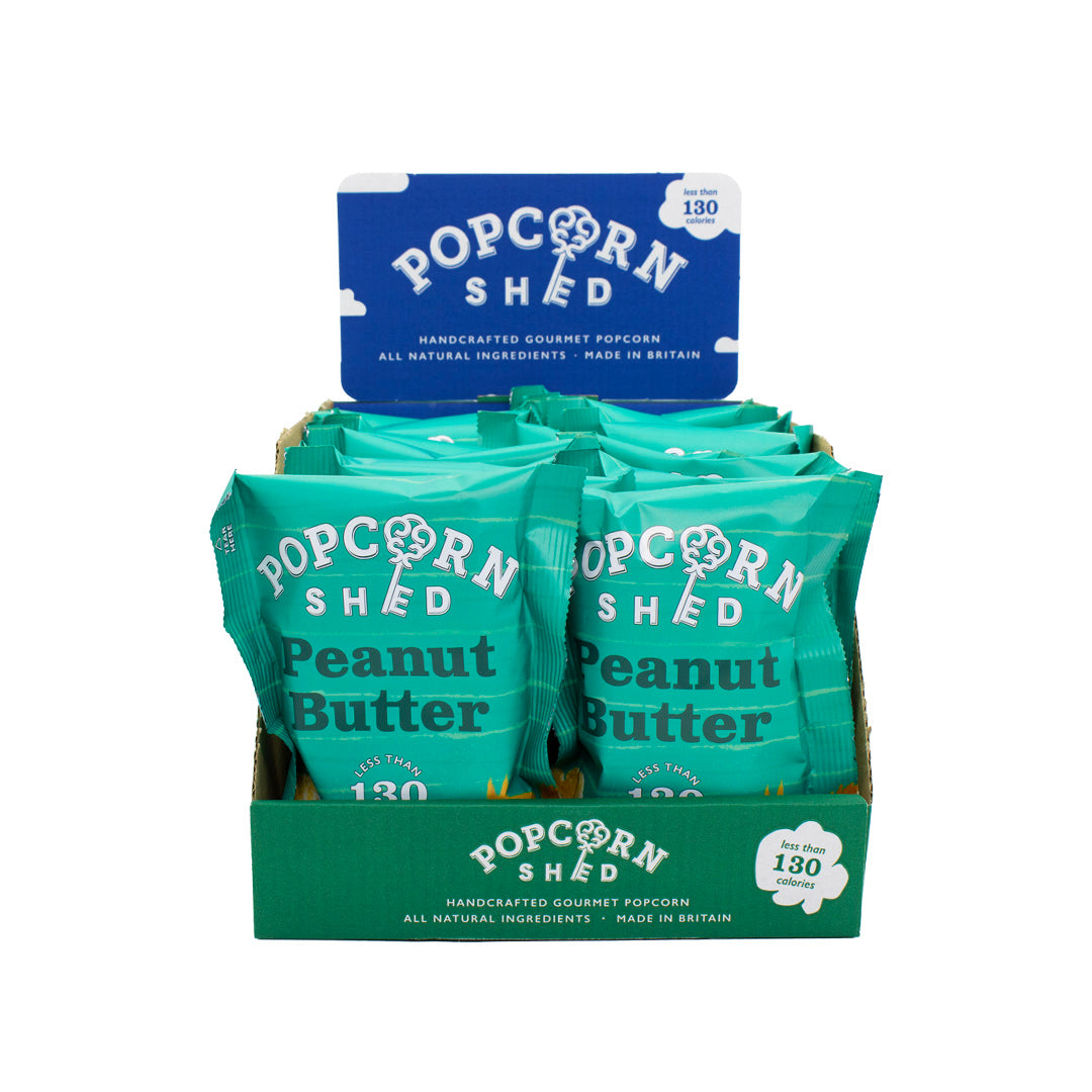 Display of Popcorn Shed Peanut Butter popcorn packets on a white background