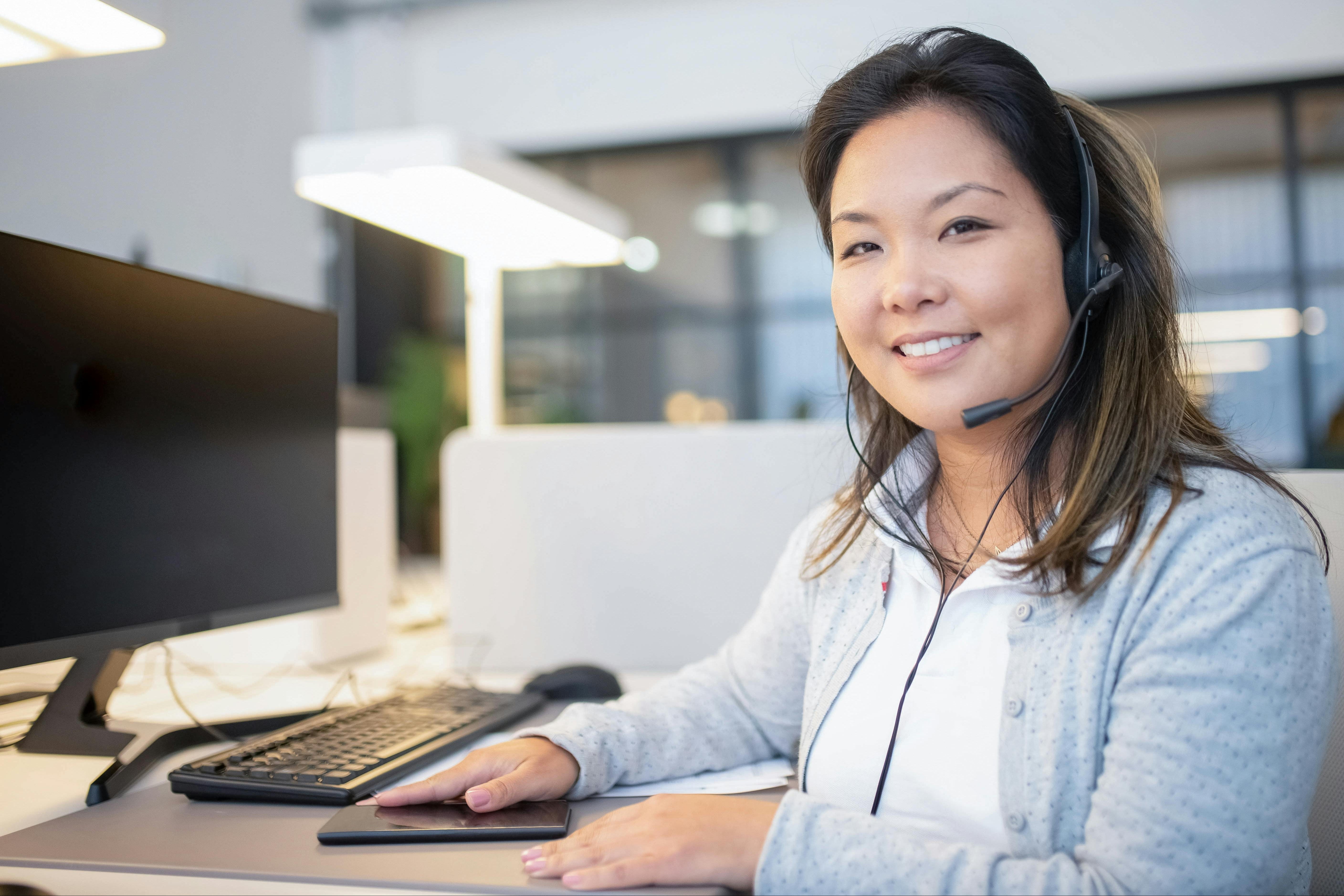 Woman wearing a headset in an office setting